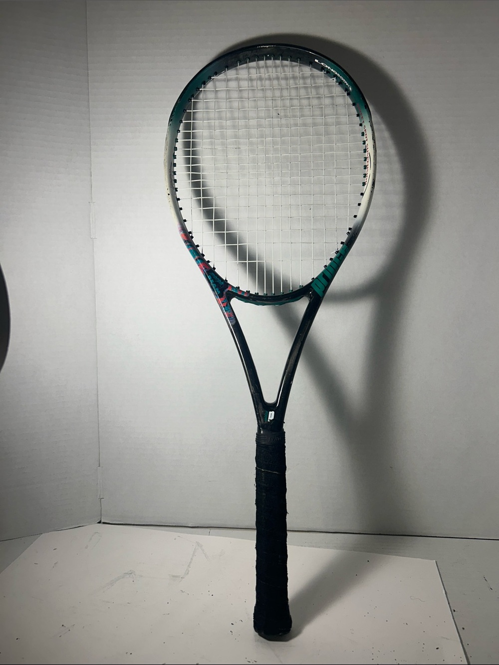 Prince Tennis Racket in Black and Teal with Pink Accents